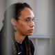Brittney Griner sits inside a defendants’ cage before a hearing at the Khimki Court, outside Moscow on July 27, 2022. (Photo by Alexander Zemlianichenko / POOL / AFP) (Photo by ALEXANDER ZEMLIANICHENKO/POOL/AFP via Getty Images)